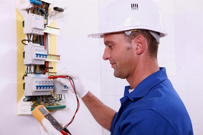 man fixing an outlet
